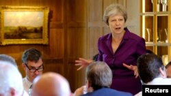 Britain's Prime Minister Theresa May commences a meeting with her cabinet to discuss the government's Brexit plans at Chequers, the Prime Minister's official country residence, near Aylesbury, July 6, 2018. 