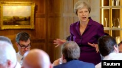 Britain's Prime Minister Theresa May commences a meeting with her cabinet to discuss the government's Brexit plans at Chequers, the Prime Minister's official country residence, near Aylesbury, Britain, July 6, 2018. 