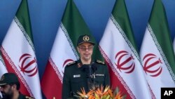 FILE - In this Sept. 21, 2016 file photo, Chief of Staff of Iran's Armed Forces, General Mohammad Hossein Bagheri delivers a speech during a military parade. On May 8, 2017, Bagheri was quoted as saying soldiers will attack terrorists wherever they are, suggesting they could go over the border into Pakistan to target militants there. The report comes after an attack claimed by the Sunni militant group Jaish-ul-Adl killed 10 soldiers in April. 