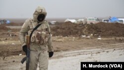 In the western deserts, soldiers contend with increasingly cold temperatures and winter mud, sometimes a foot deep, in Nineveh province, Iraq, Dec. 15, 2016.