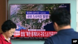 FILE - A man watches a TV reporting on a possible nuclear test conducted by North Korea at the Seoul Railway station in Seoul, South Korea, Sept. 3, 2017. A similar quake was detected Saturday.