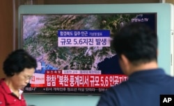 A man watches a TV reporting on a possible nuclear test conducted by North Korea at the Seoul Railway station in Seoul, South Korea, Sept. 3, 2017.