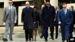 FILE - Officer Edward Nero, left, Lt. Brian Rice, second from left, and Officer Garrett Miller, at right, three of six Baltimore city police officers charged in connection to the death of Freddie Gray, leave the Maryland Court of Appeals, March 3, 2016.