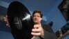 Kevin Stuart about to put another vinyl record on the turntable inside his Record Mad store in Johannesburg. (Darren Taylor for VOA News)