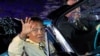 Boxing great Muhammad Ali waves to the crowd during the opening ceremony of the World Equestrian Games in Lexington, Kentucky, in this September 25, 2010 file photo.