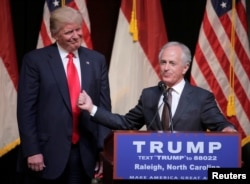 FILE - Republican U.S. presidential candidate Donald Trump listens as Sen. Bob Corker speaks at a campaign rally in Raleigh, North Carolina, July 5, 2016.