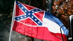 FILE - The state flag of Mississippi is unfurled on the grounds of the state Capitol in Jackson, Mississippi, Jan. 19, 2016. An effort to erase the Confederate battle emblem from the Mississippi flag has failed because sponsors didn't gather enough signatures to put an initiative on the 2018 ballot.