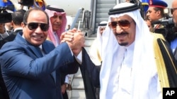 FILE - Egyptian President Abdel Fattah el-Sissi, left, shakes hands with Saudi Arabia's King Salman before he departs Egypt, April 11, 2016.