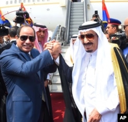 FILE - Egyptian President Abdel-Fattah el-Sissi, left, shakes hands with Saudi Arabia's King Salman before he departs Egypt, April 11, 2016.