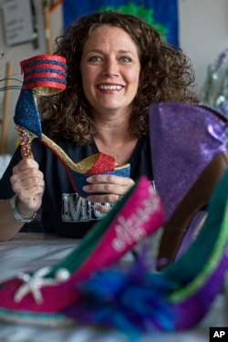Cari Rhoton, a lieutenant in an all-female Mardi Gras parade group known as the Krewe of Muses, creates the group's signature shoes from her garage in Kenner, La., Jan. 10, 2016.