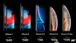 Phil Schiller, Apple's senior vice president of worldwide marketing, speaks about the new Apple iPhone XS, iPhone XS Max and the iPhone XR at the Steve Jobs Theater during an event to announce new Apple products, Sept. 12, 2018, in Cupertino, Calif. 