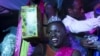 FILE: While Nigeria's lawmakers now consider a bill making cross-dressing a crime, Mahad, who identifies as a transgender woman, smiles after winning the Miss Pride beauty contest in Kampala, Uganda, Aug. 7, 2015. 