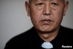 Dong Guanhua, an outspoken priest and the head of a local "underground" Catholic church, poses for a portrait in Youtong village, Hebei province, China, March 30, 2018.