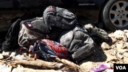 Bags, including children's school bags, and other personal belongings have been pulled out from the rubble of a collapsed under-construction building in Cambodia's coastal town Kep, Sunday, January 05, 2020. (Khan Sokummono/VOA Khmer) 