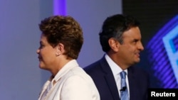 FILE - Brazil's presidential candidates Aecio Neves (R) of Brazilian Social Democratic Party (PSDB) and Dilma Rousseff of Workers Party (PT) take part in a TV debate in Rio de Janeiro Oct. 2, 2014.