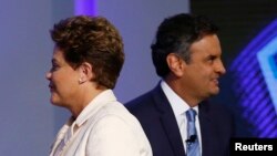 Brazil's presidential candidates Aecio Neves (R) of Brazilian Social Democratic Party (PSDB) and Dilma Rousseff of Workers Party (PT) take part in a TV debate in Rio de Janeiro, Oct. 2, 2014.