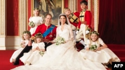 Clarence House handout photo of Britain's Prince William posing with his wife Kate, Duchess of Cambridge and their pageboys and bridesmaids (clockwise from bottom right) Margarita Armstrong-Jones, Eliza Lopes, Grace van Cutsem, Louise Windsor, Tom Pettif