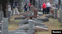 Local and national media report on more than 170 toppled Jewish headstones after a weekend vandalism attack on Chesed Shel Emeth Cemetery in University City, a suburb of St Louis, Missouri, Feb. 21, 2017. 