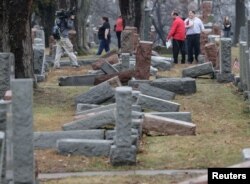 Local and national media report on more than 170 toppled Jewish headstones after a weekend vandalism attack on Chesed Shel Emeth Cemetery in University City, a suburb of St Louis, Missouri, Feb. 21, 2017.