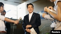 Japanese Prime Minister Shinzo Abe speaks to reporters about North Korea's missile launch in Tokyo, Japan, in this photo taken by Kyodo, Aug. 29, 2017.