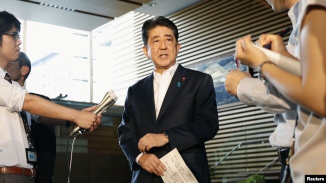 Japanese Prime Minister Shinzo Abe speaks to reporters about North Korea's missile launch in Tokyo, Japan, in this photo taken by Kyodo, Aug. 29, 2017.