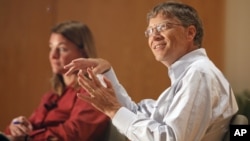 Bill Gates, accompanied by his wife Melinda speak to students at an appearance at Central Piedmont Community College in Charlotte, North Carolina. 