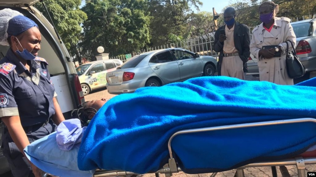 Johanna Mamombe in a stretcher at a private hospital in Harare. (VOA)