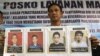 North Sumatra Regional Police spokesperson Col. Raden Heru Prakoso shows the mug shots of four convicted terrorist who were among more than 200 inmates who escaped Tanjung Gusta prison, July 16, 2013.