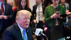 President Donald Trump sits for a radio interview in the Eisenhower Executive Office Building in the White House complex in Washington, Oct. 17, 2017. 