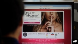 FILE - Hacking of the Ashley Madison website, with its troves of intimate information, should concern more than the people listed there.