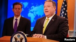 Secretary of State Mike Pompeo and Ambassador-at-Large Sam Brownback at release of annual report on international religious freedom May 29, 2018.