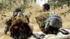 FILE - Members of an Oromo rebel group chat under a tree at their training camp in Ethiopia. Peace talks between Ethiopia's federal government and the rebel Oromo Liberation Army began April 25, 2023, and have raised hopes of ending years of violence between the two sides.