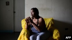 Luber Faneitte, a 56-year-old diagnosed with lung cancer, talks during a interview with AFP at her house in the San Agustin shantytown in Caracas on Nov. 10, 2017. Faneitte fears that if Venezuela defaults on its $150 billion debt, which is considered likely, the country's economic crisis will only worsen.
