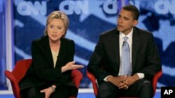 FILE - Then-Sen. Hillary Clinton, D-N.Y., answers a question alongside then-Sen. Barack Obama, D-Ill., during a presidential primary debate in Manchester, N.H., June 3, 2007. Obama formally endorsed Clinton's 2016 White House bid on June 9. 