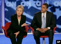 FILE - In this June 3, 2007, file photo, then-Democratic presidential candidates Hillary Clinton and Barack Obama participate in a debate in Manchester, N.H.