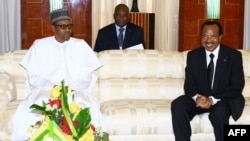 President of Cameroon Paul Biya (R) meeting with his Nigerian counterpart, Muhammadu Buhari, at the presidential palace in Yaounde, Cameroon, July 29, 2015.