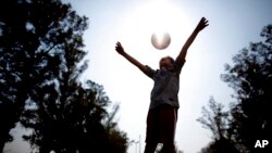 Candelaria Cabrera plays with a soccer ball in Chabas, Argentina on Saturday, September 8, 2018. 