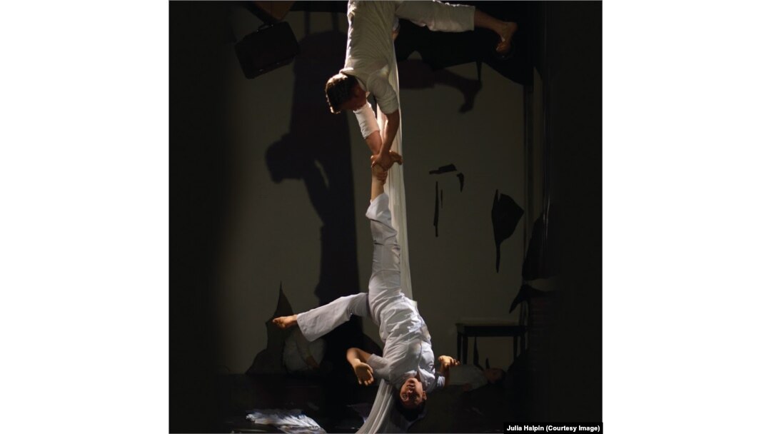 Only Child Aerial Theatre's Sloan Bradford (top) and co-founder Nicki Miller perform on aerial silks in ASYLUM.