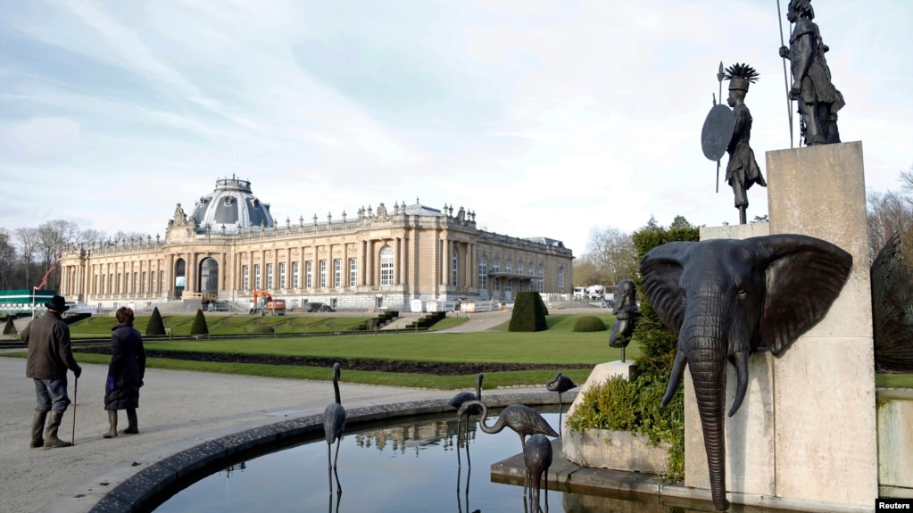 FILE -- A modern sculpture by Belgian artist Tom Frantzen shows former Belgian King Leopold II surrounded by animals and African warriors in the park of the Royal Museum for Central Africa in Tervuren, Belgium, Jan. 22, 2014. After a five-year remodel, it reopened, Dec. 8, 2018.