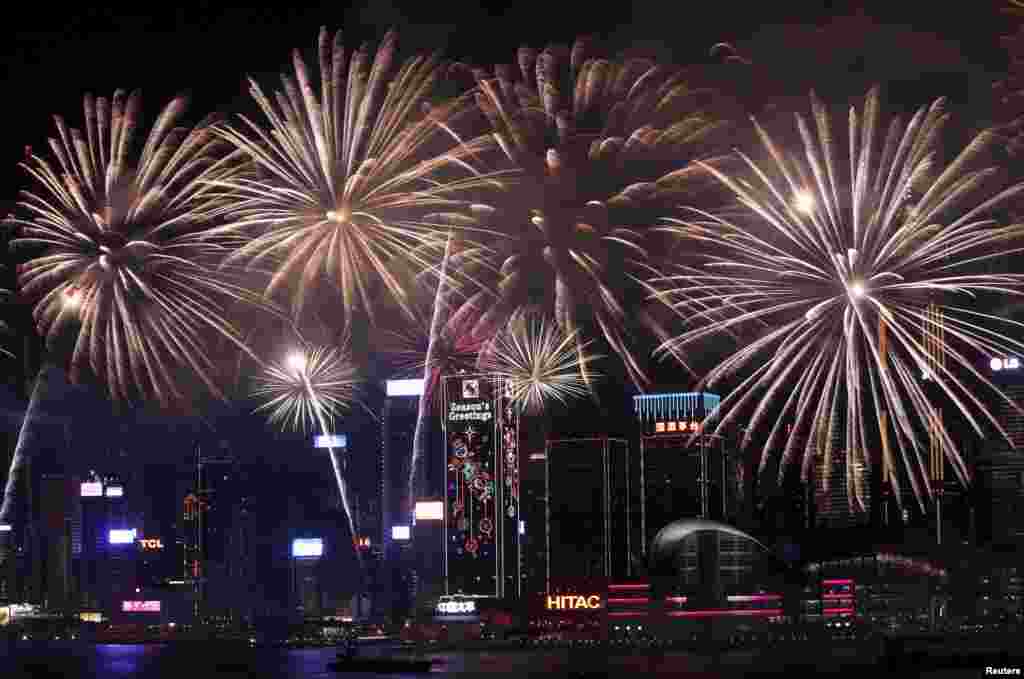 Fireworks explode over the Victoria Harbor of Hong Kong to celebrate the Lunar New Year of the Monkey.