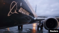 FILE - A Boeing 737 MAX sits outside the hangar during a media tour of the Boeing 737 MAX at the Boeing plant in Renton, Washington.