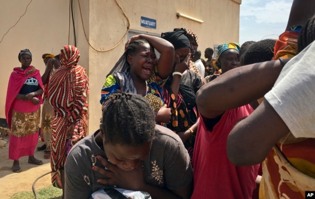 Relatives of the six slain aid workers grieve in Juba, South Sudan, March 27, 2017. Twelve aid workers have been killed so far this year in South Sudan.