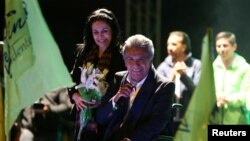 Lenin Moreno, candidate of the ruling PAIS Alliance Party, and his wife Rocio Gonzalez celebrate the early results of the presidential election with supporters in Quito, Ecuador, Feb. 19, 2017. 