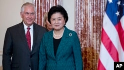 Secretary of State Rex Tillerson welcomes Chinese Vice Premier Liu Yandong during a working breakfast at the State Department, Sept. 28, 2017, in Washington.