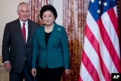 Secretary of State Rex Tillerson welcomes Chinese Vice Premier Liu Yandong during a working breakfast at the State Department, Sept. 28, 2017, in Washington.