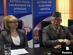 The United Nations' first independent expert on albinism, Ikponwosa Ero, left, and Kenya's first Member of Parliament with albinism, Isaac Mwaura, address the media in Kenya's capital Nairobi, Nov. 16, 2016.