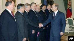 Russian President Putin, right, greets leaders in the outgoing lower house of parlament — Pekhtin is fifth from left — the Kremlin, Moscow, Dec. 11, 2003.