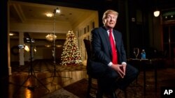 FILE - Republican presidential candidate Donald Trump speaks during an interview at the Trump National Golf Club in Sterling, Virginia, Dec. 2, 2015.