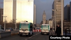 Two driverless electric shuttle buses are shown in Paris, France during a recent demonstration of the technology on the city's streets. (Courtesy: EasyMile)