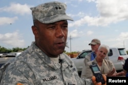 FILE - U.S. Major General Darryl Williams speaks to journalists at the Roberts international airport outside Monrovia, Oct. 9, 2014.